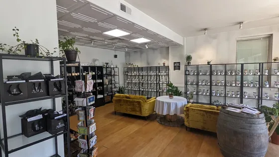 Inside Scents by Design — shelves of hand-poured candles and a seating area